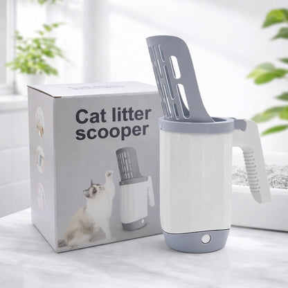 Cat litter scoop with packaging on a light surface