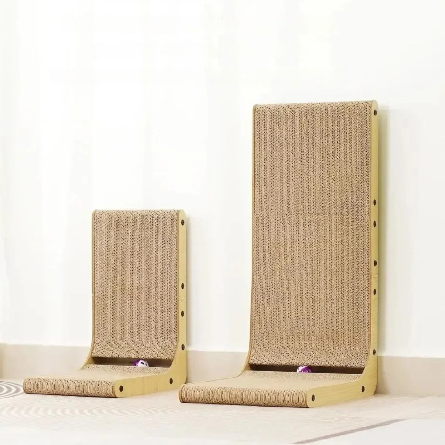 Two cat scratchers with sisal-wrapped posts on a white background