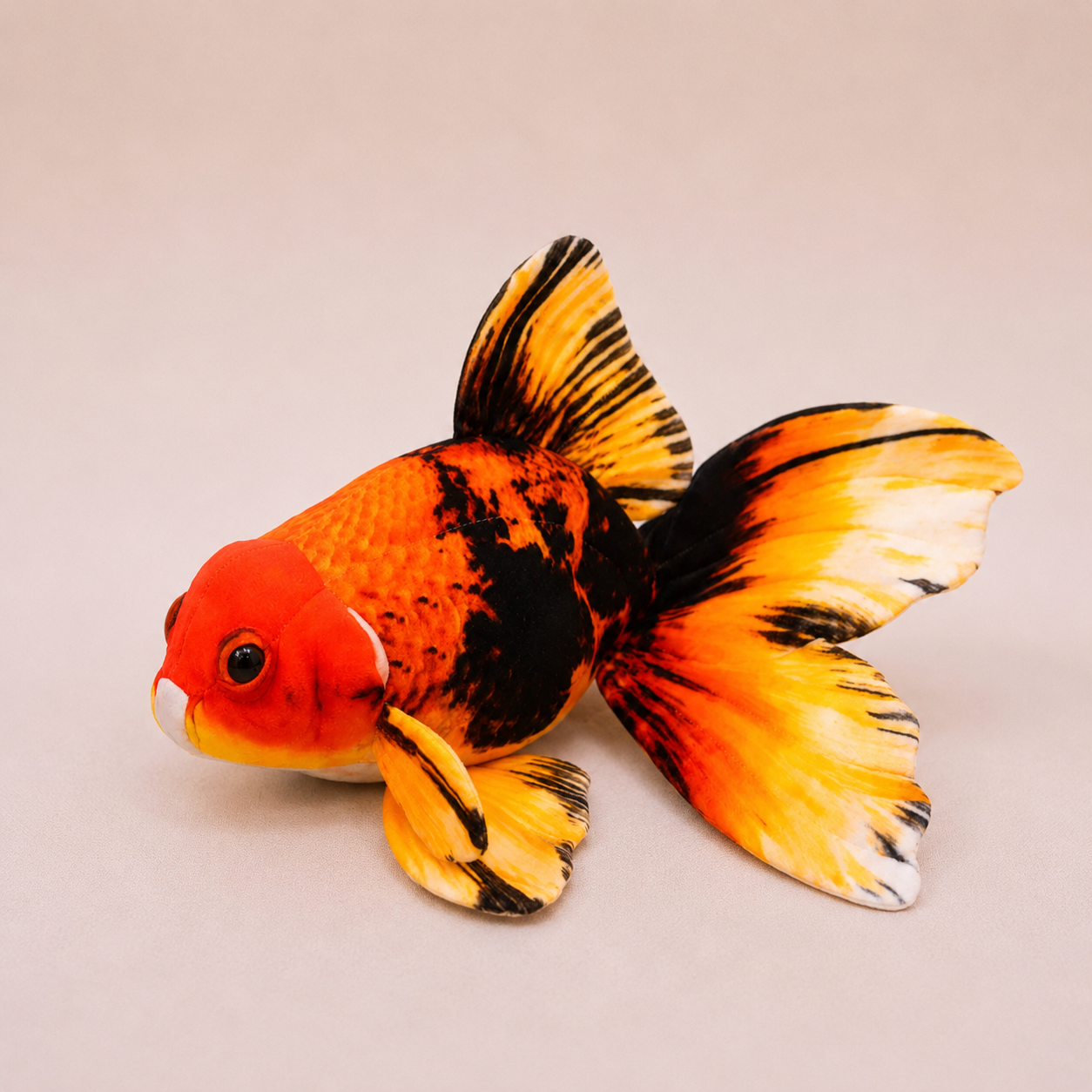 Large Goldfish Kicker Plush for Cats on a beige background