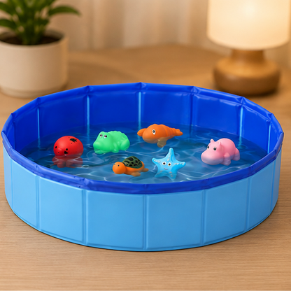 A blue collapsible plastic water pool on a wooden table, filled with water and several colorful toy animals including a red octopus, green crocodile, orange lobster, turtle, blue starfish, and pink hippo.
