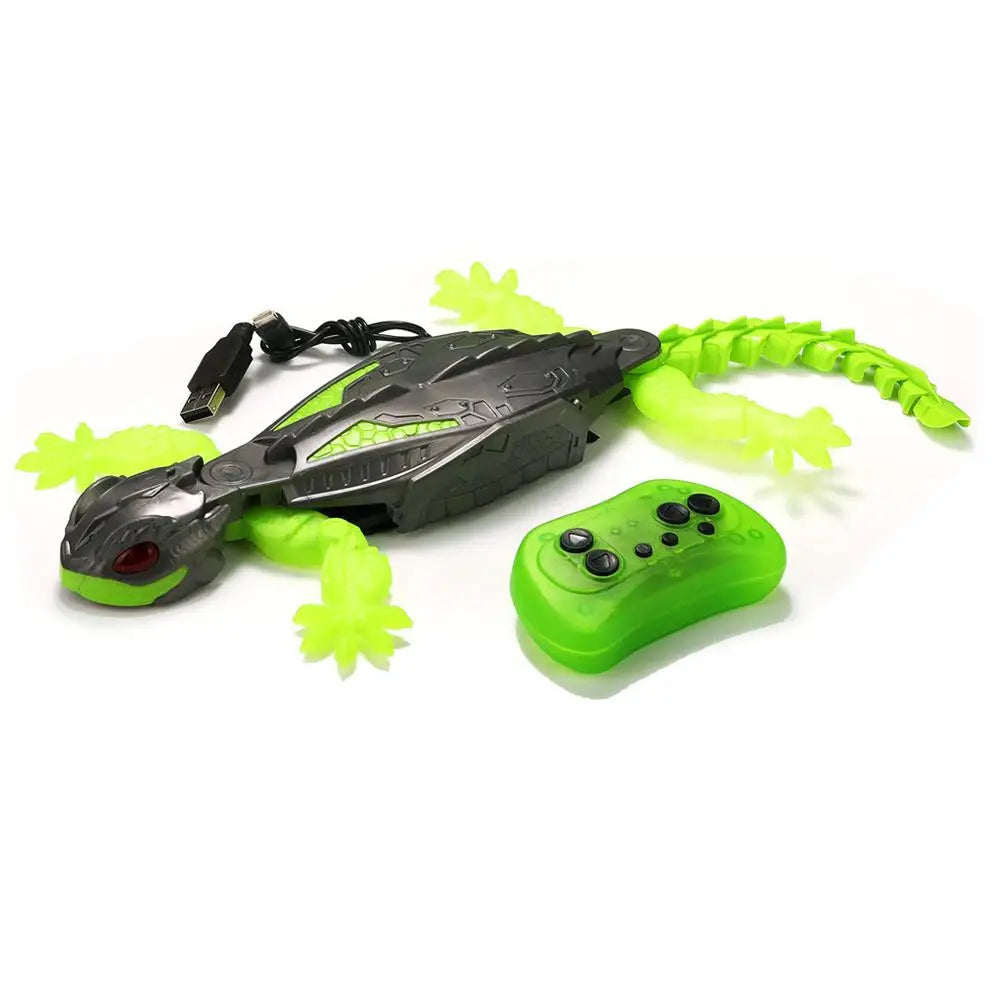 Toy lizard with remote control on a white background