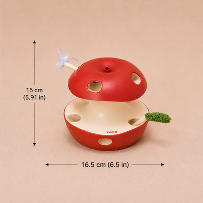 A red apple-shaped cat toy with a cream-colored interior, shown with dimension arrows and text indicating a height of 15 cm (5.9 in) and width of 16.