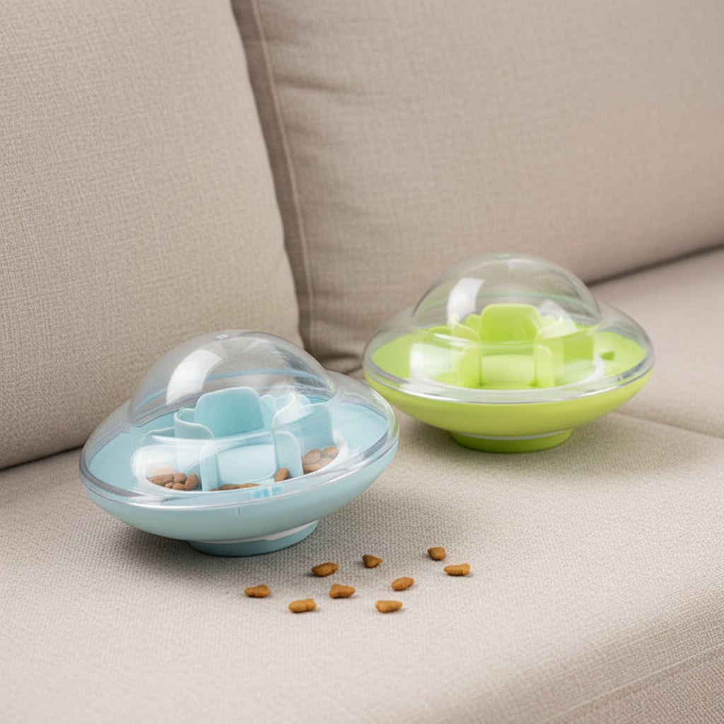 2 UFO Treat Tumbler on a sofa with treats