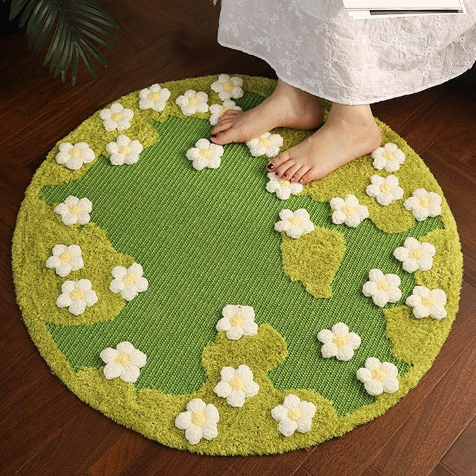 Green floral-patterned rug on a wooden floor with a person stepping onto it.