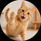 An orange tabby cat with green eyes playfully raising one paw, captured in a warm, softly lit indoor setting with a black circular vignette around the photo.