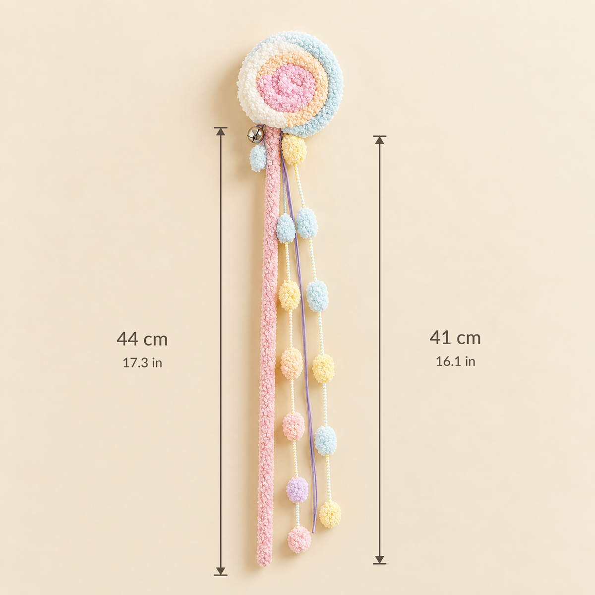 Size guide graphic for the Sweet Swirl Plush Cat Teaser Wand, displaying a wand length of 44 cm (17.3 in) and plush swirl length of 41 cm (16.1 in) against a cream background.